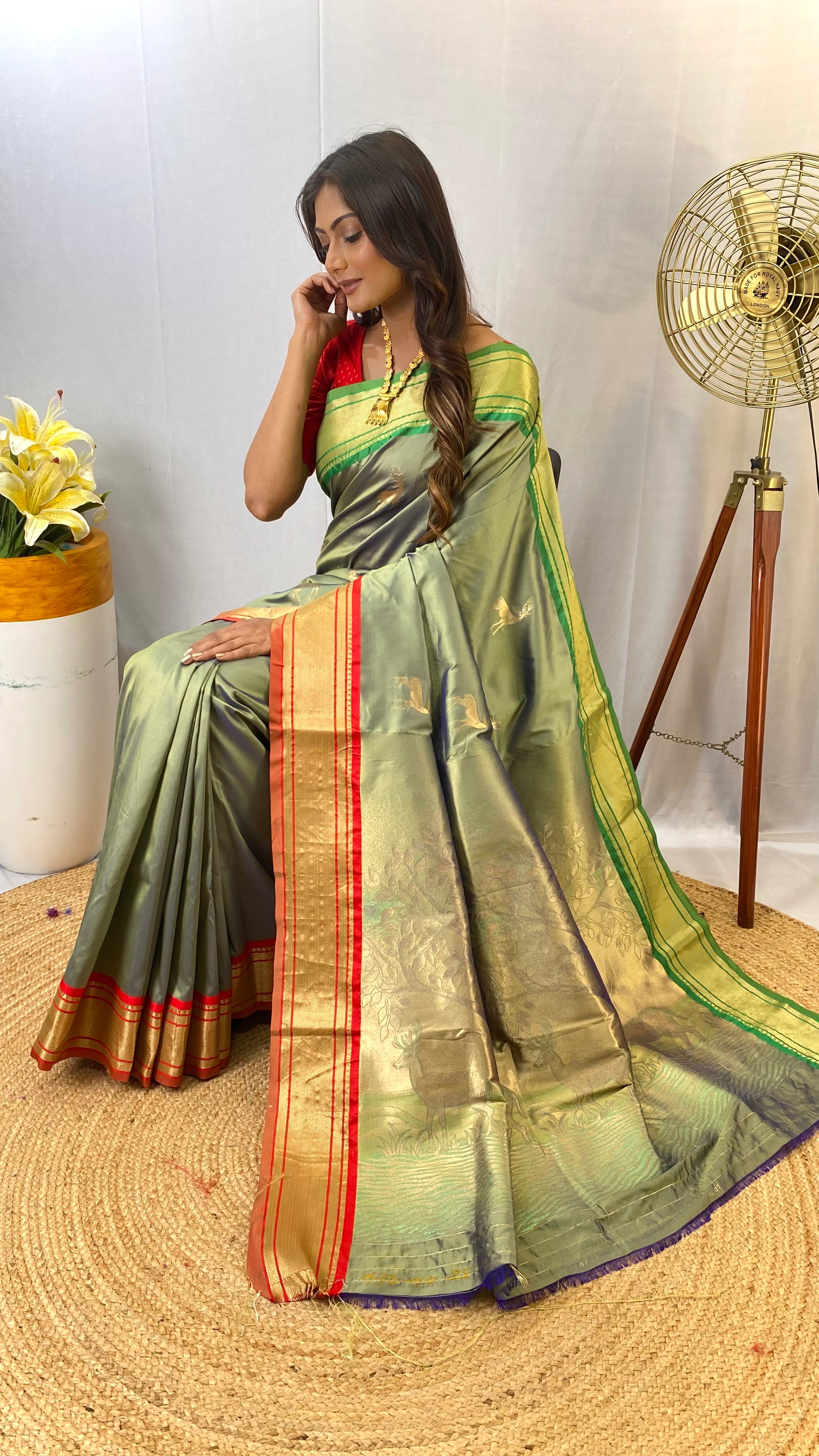 Awe-inspiring Pista Green Color Soft Silk Saree with Deer Motifs