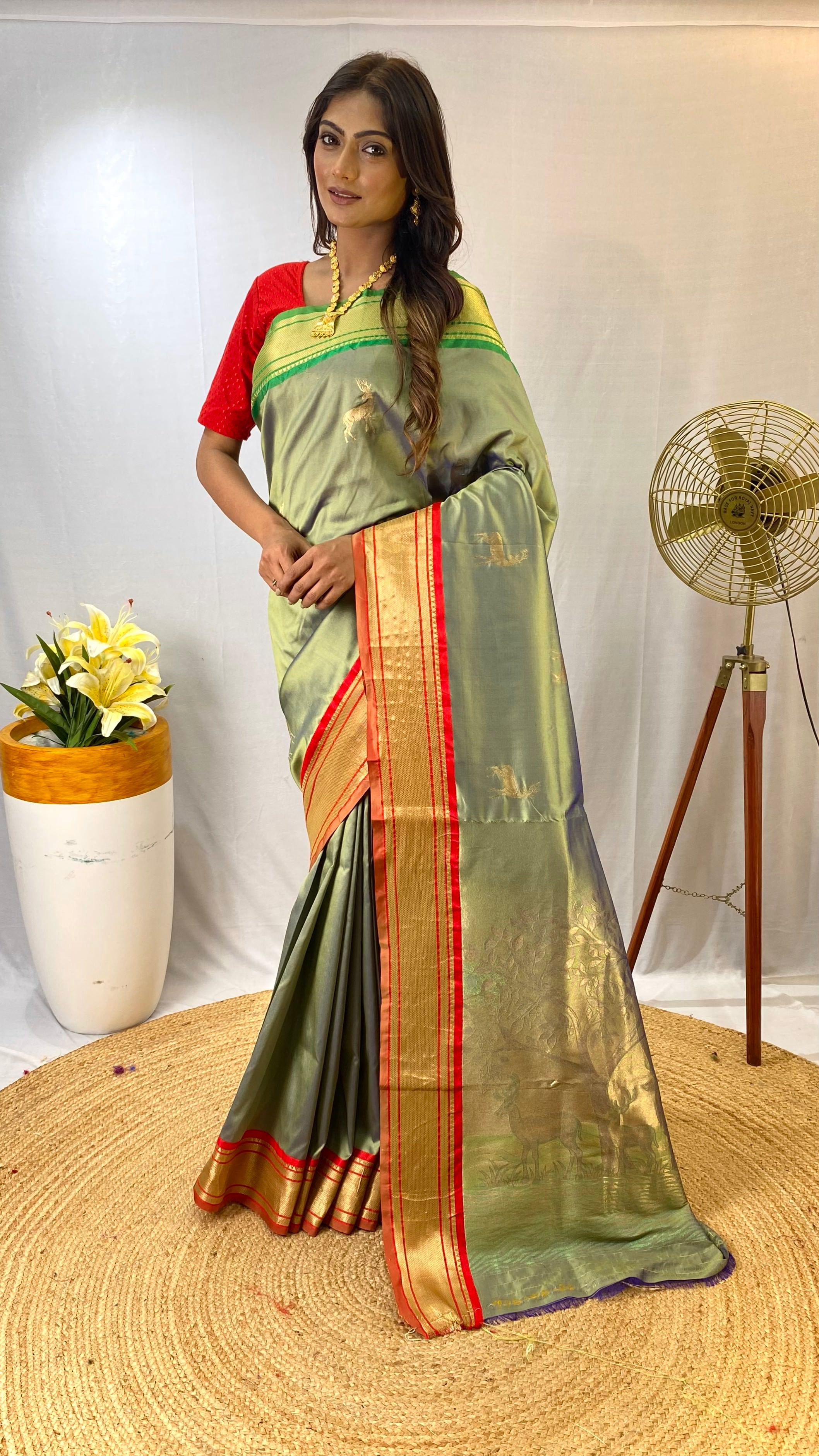 Awe-inspiring Pista Green Color Soft Silk Saree with Deer Motifs