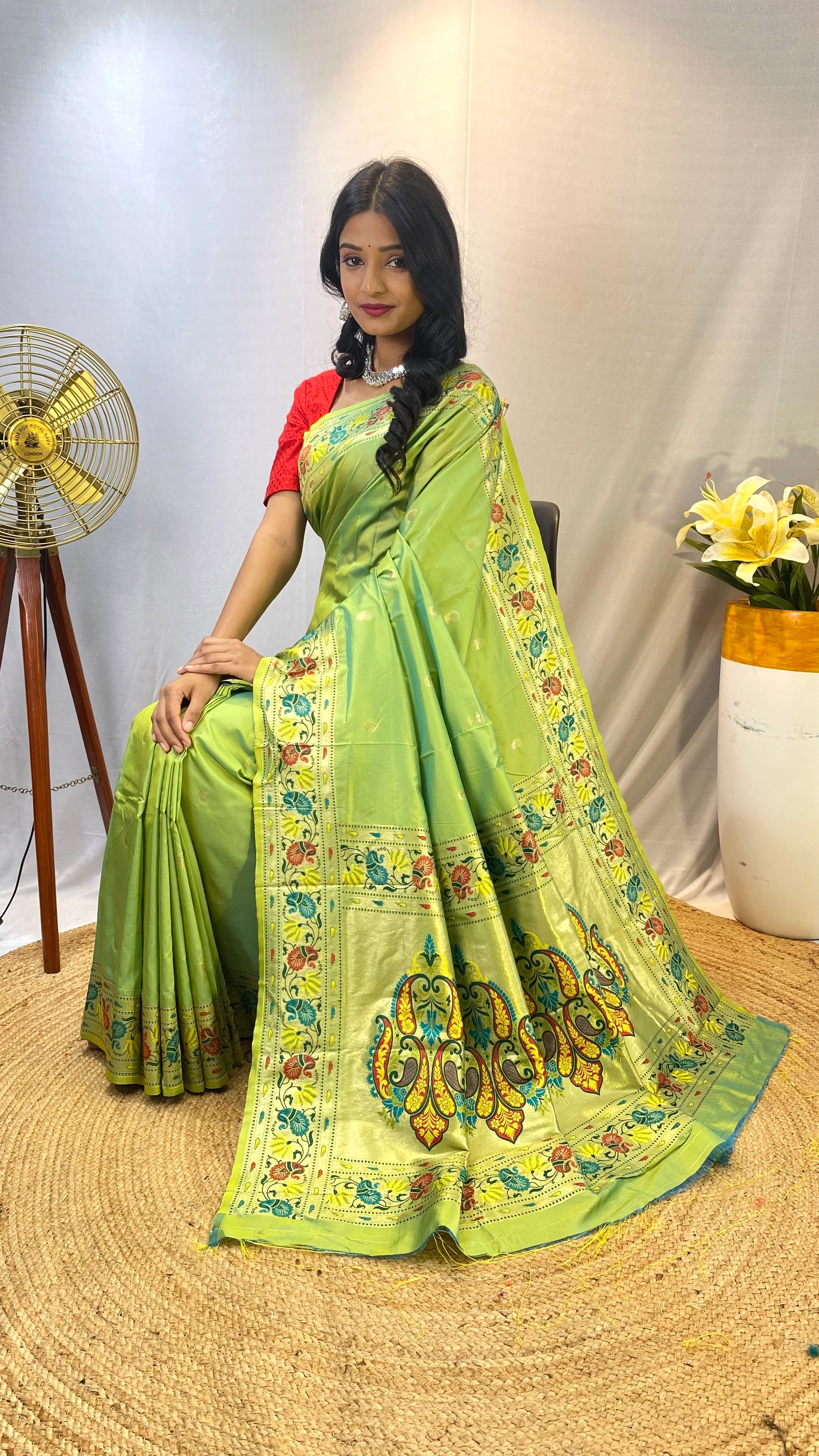 Luminescent Pista Green Color Paithani Silk Saree with Meenakari Weaving Work