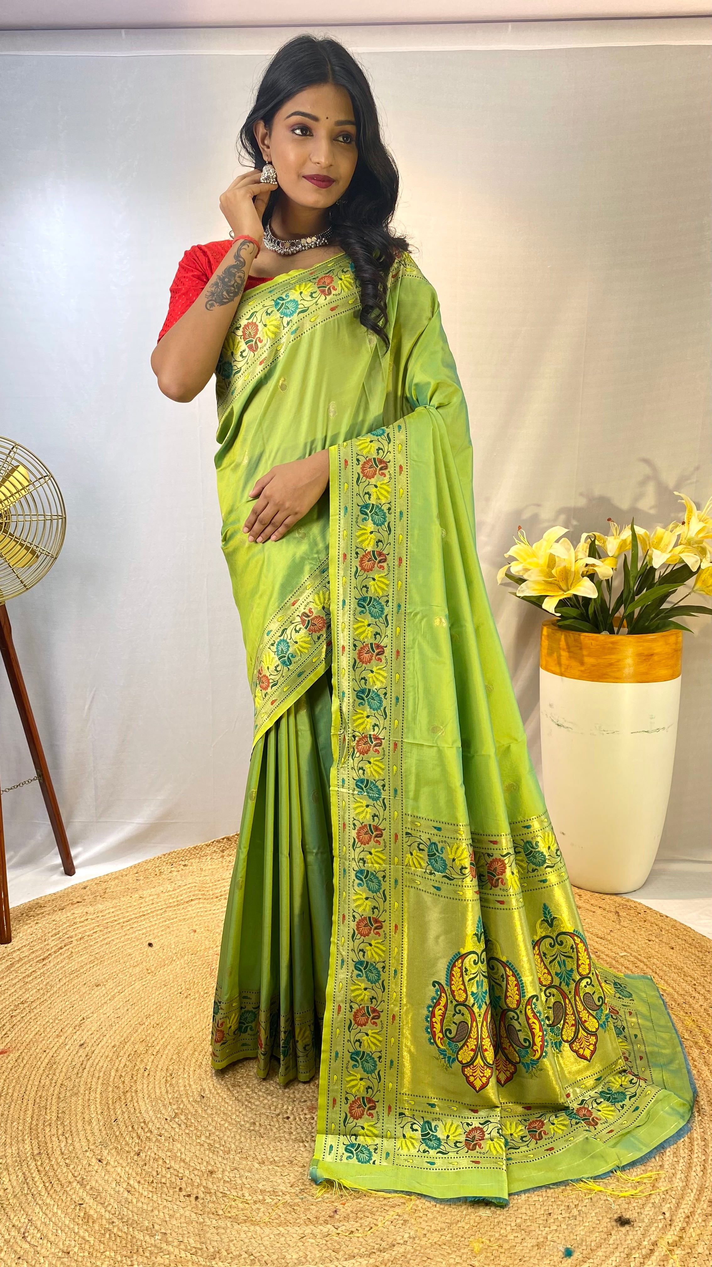 Luminescent Pista Green Color Paithani Silk Saree with Meenakari Weaving Work