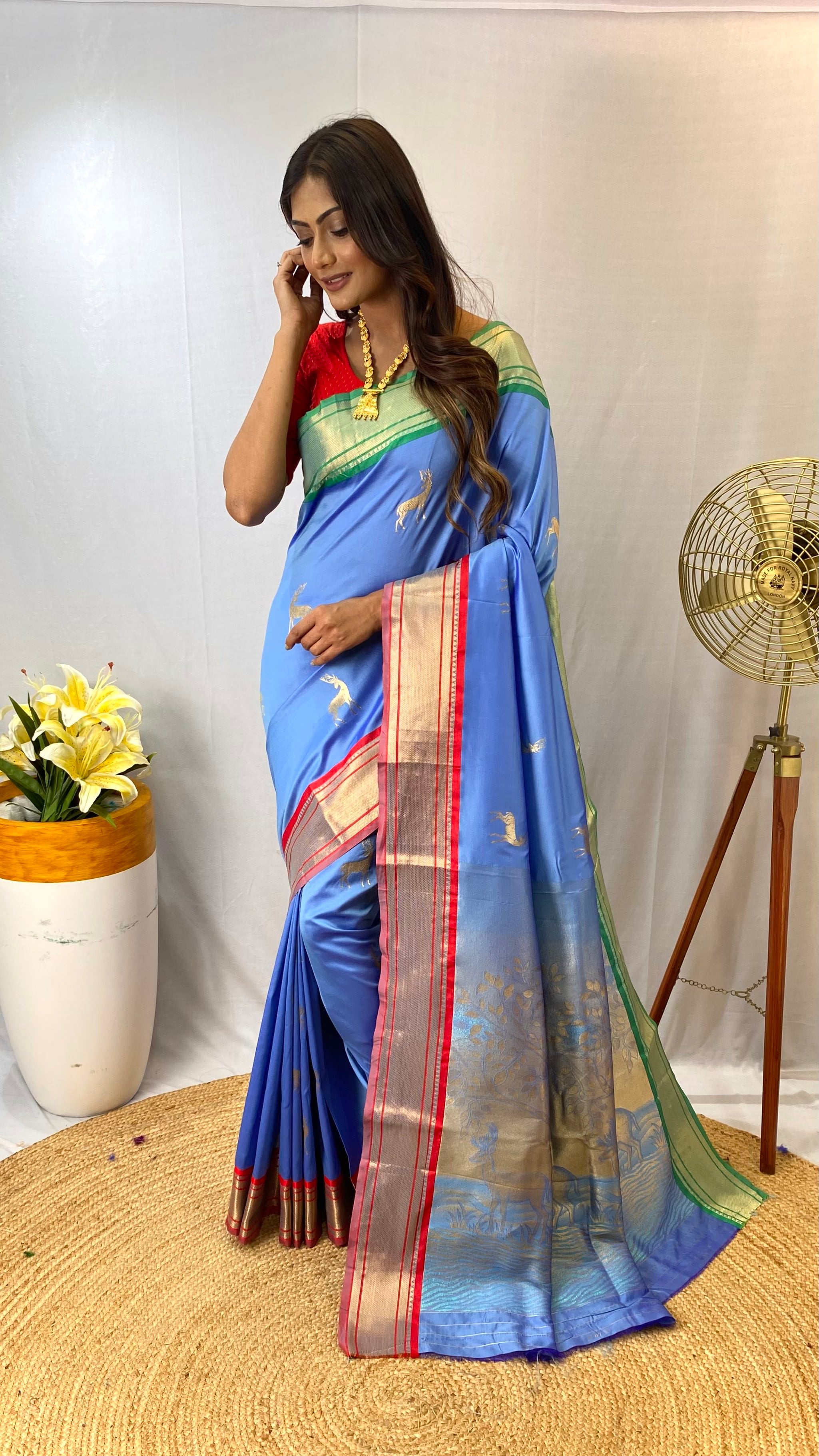 Blissful Sky Blue Color Soft Silk Saree with Deer Motifs